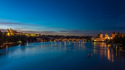 View of the city Prague in Czech Republic day to night timelapse on the Vltava river with beautiful sky
