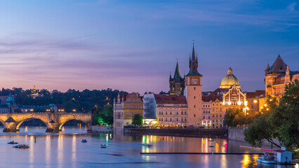 Fototapeta premium View of the city Prague in Czech Republic day to night timelapse on the Vltava river with beautiful sky