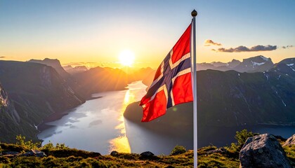 Norwegian flag waving over fjord at sunset (1)