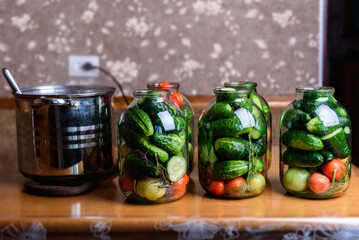Preservation of season vegetables. Preparation vegetables in jars and ingredients for canned food, cooking process.