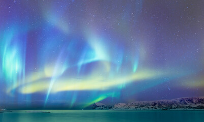 Northern lights or Aurora borealis in the sky - Tromso, Norway