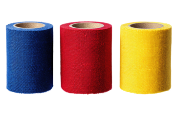 Three vertical rolls of colorful fabric in primary shades, set against a black backdrop