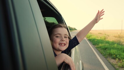 road, kid child enjoying sun travel travel, vacation time, traveling by car with windows open, child kid loves leaning out window, fingers, happy family, feeling freedom joy, freedom summer car ride