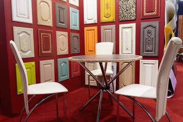 A variety of kitchen furniture fronts in different materials, displayed in a showroom