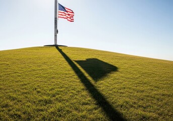 American Flag at half-mast with shadow on mountain