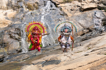 Traditional Folk Dancers Performing by a Waterfall in India