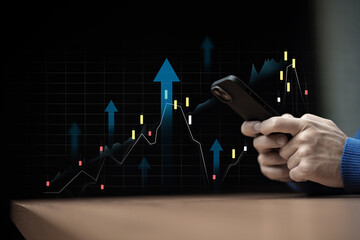 Active trader analyzes market trends using smartphone in a dark setting