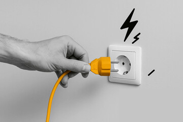 Hand Plugging in a Power Cord – Energy Connection Concept