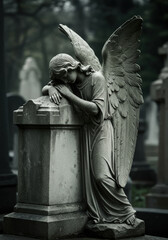 Statue of weeping angel in cemetery