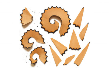 Pencil shavings creating shapes with spiral and pointed wood pieces, school and art supplies, transparent background