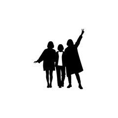 Silhouette of three people standing together with one raising their hand up