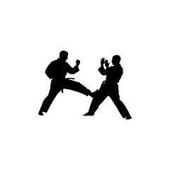Two karate practitioners in silhouette engaged in a sparring match against white