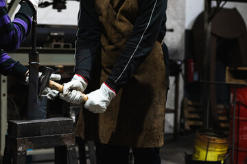 people molding tool in iron forging workshop