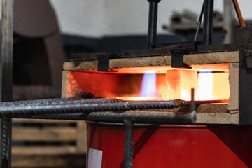 blacksmith furnace with burning fire and forging tools