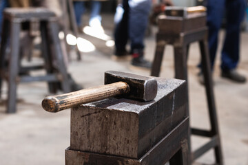 Workshop with hammer on anvil at firs plan