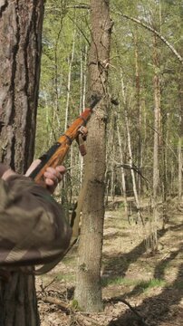 Reenactor Dressed As German Infantry Soldier Shoots From Rifle Carabine Mauser 98k. Weapon Jammed. War Ambush In Forest. Wermacht Military Uniform. Reenactment Combat. Reload And Shooting From Rifle