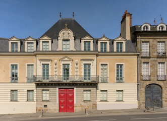 Fototapeta premium Neo-classical apartment buidling with sculpted decoration of lions on a sunny day in Rennes, France 