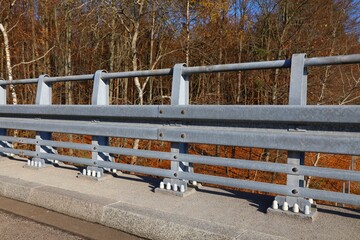 Guardrail traffic barrier on the side of a highway bridge in Malopolskie region, Poland. Transportation infrastructure.