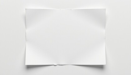 A white sheet of paper is folded into a triangular shape.