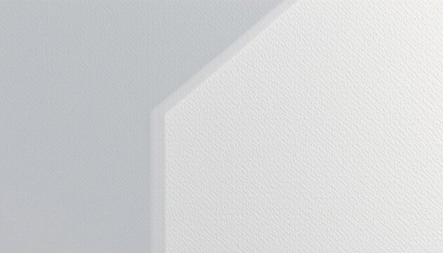 A large, rectangular white structure with a rough texture against a backdrop that appears to be a light grey surface.