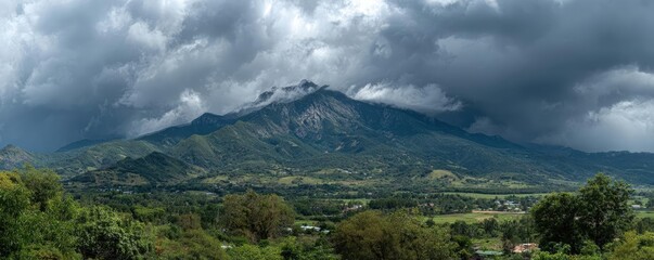 Strong wind hurricane hitting island flood concept. Breathtaking mountain landscape under a cloudy sky.