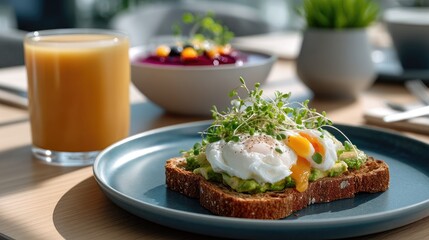 A plate features a slice of toast topped with a perfectly poached egg and fresh sprouts, complemented by a berry drink