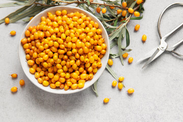 Sea buckthorn berries in bowl ready for harvest