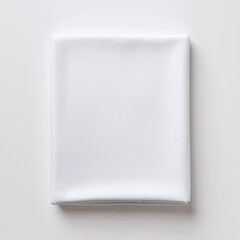 Folded white fabric sheet on a light background. Clean textile and laundry concept. Minimalist top view with copy space for text