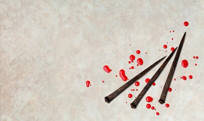 Christian rusty nails with drops of blood. Crucifixion.