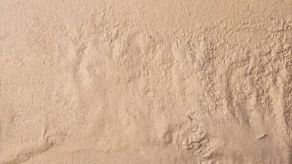 Old orange cement walls, peeling paint, swollen paint, stains and scratches, damaged and...