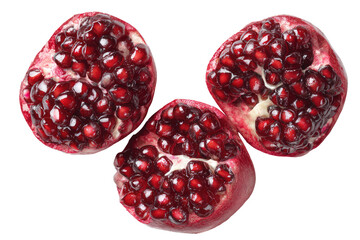 Three pomegranate halves, vibrant red seeds (2)
