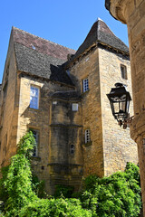 Visitors marvel at the stunning medieval architecture in Sarlat, Dordogne, with its characteristic...