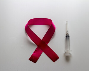 World AIDS Day emblem and syringe. On a white background.