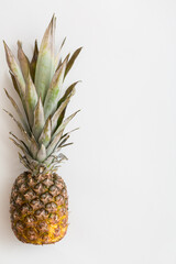 Top view on fresh juicy pineapple on white background. Close up