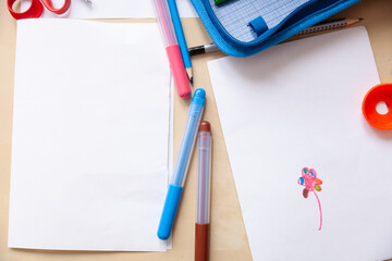 Top view of children's drawing, colorful felt-tip pens. Creative ideas, creativity and early learning. Creative space. Education concept.