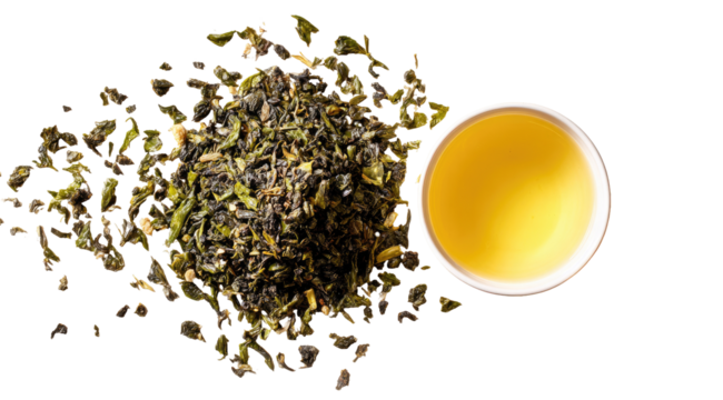 Loose leaf tea, scattered leaves, and a cup of brewed tea