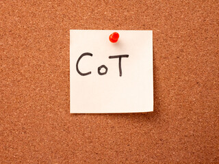 CoT acronym for Chain of Thought on a sticky note on a corkboard