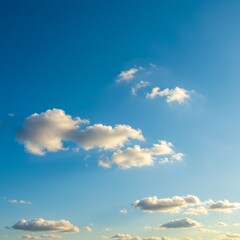 Bright Sky with White Cumulus Clouds on a Sunny Day with Golden Hour Lighting