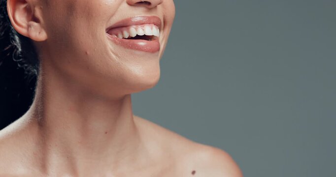 Dental, smile and teeth of woman in studio with whitening treatment, implant results or mockup space. Cosmetics, happy person and mouth on gray background with oral health, veneer cleaning or hygiene