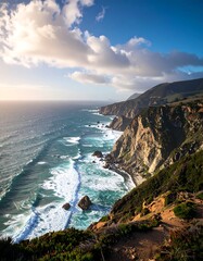 Dramatic coastal cliffs meet a churning ocean. Sunlight highlights the rugged landscape