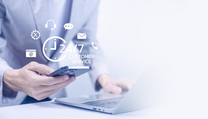 Businessman using smartphone and laptop with 24-hour customer service icons, representing online communication, helpdesk, client support, and business technology connection. Contact us concept