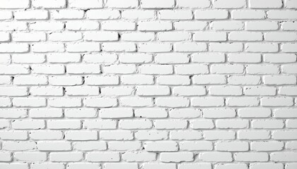 Fototapeta premium A close up view of a brick wall with a rough texture. The bricks appear to be white or off white in color, giving it an old or distressed look