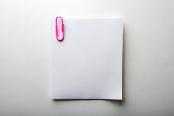 A single blank white sheet of paper held by a bright pink paper clip on a clean white background