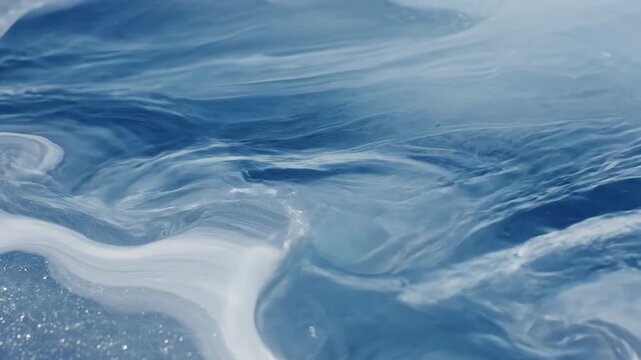 Seamlessly looping abstract background of slow-moving liquid patterns resembling melting ice and flowing water smooth, transparent, subtle