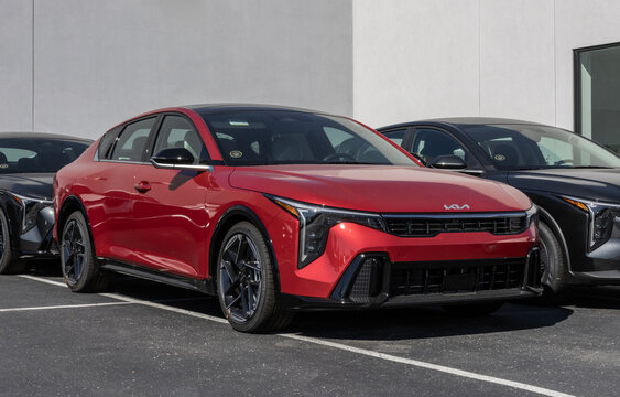 Kia K4 GT-Line Compact Sedan display at a dealership. Kia offers the K4 with a 2.0L MPI 4-Cylinder engine. MY:2025