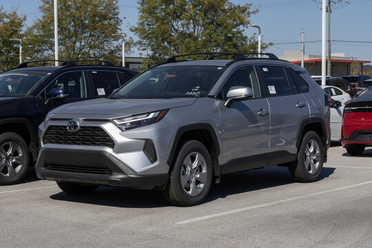 Toyota RAV4 Hybrid XLE AWD SUV display at a dealership. Toyota offers the RAV4 with a 2.5L 4-Cylinder hybrid engine. MY:2025