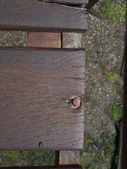 Close-Up of Weathered Wooden Pier Structure with Nail Detail