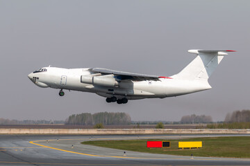 Take off white wide body transport cargo aircraft