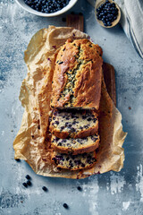 Homemade blueberry cake on rustic kitchen surface. Top view