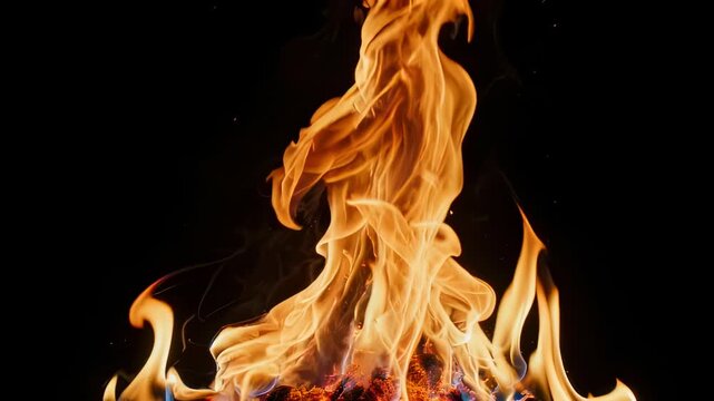 Close-up of vibrant flames dancing against a stark black backdrop. The dance of light and shadow